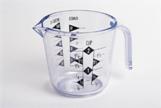 The image shows a photograph of a measuring cup.